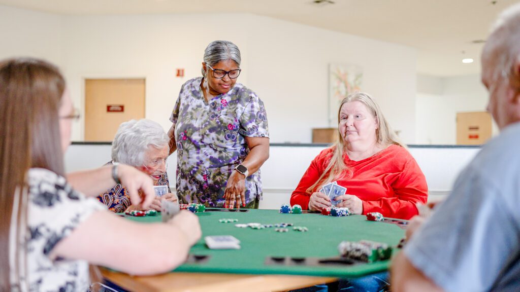 An activity that residents with long term care and short term care and respite care are playing at Chambers Health and Rehab