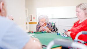 An activity that residents with long term care and short term care and respite care are playing at Chambers Health and Rehab