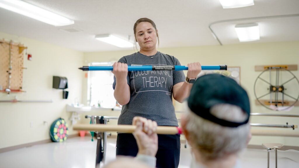 A Nurse assists a short term care patient at chambers health and rehab, a skilled nursing facility