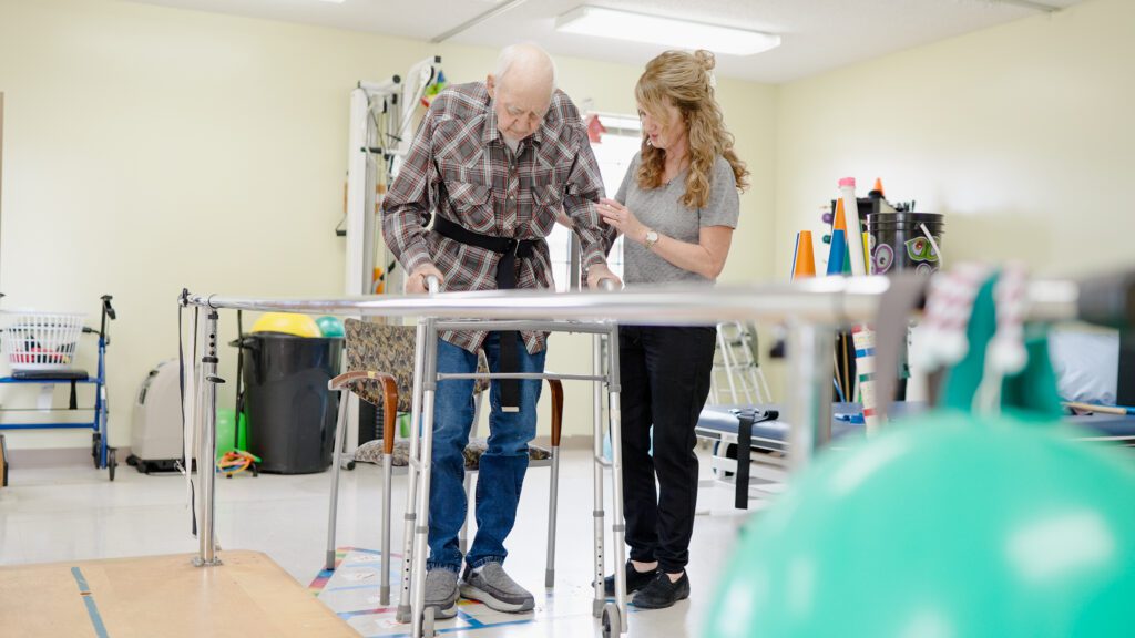 A Nurse assists a short term care patient at chambers health and rehab, a skilled nursing facility